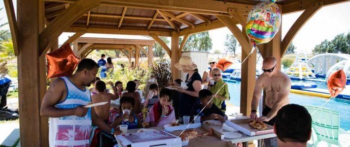 Beach bonfire at sunset at Velocity Island Park